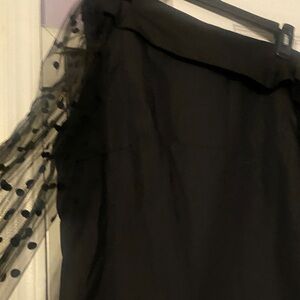 Elegant Black Top with Sheer Polka Dot Sleeves